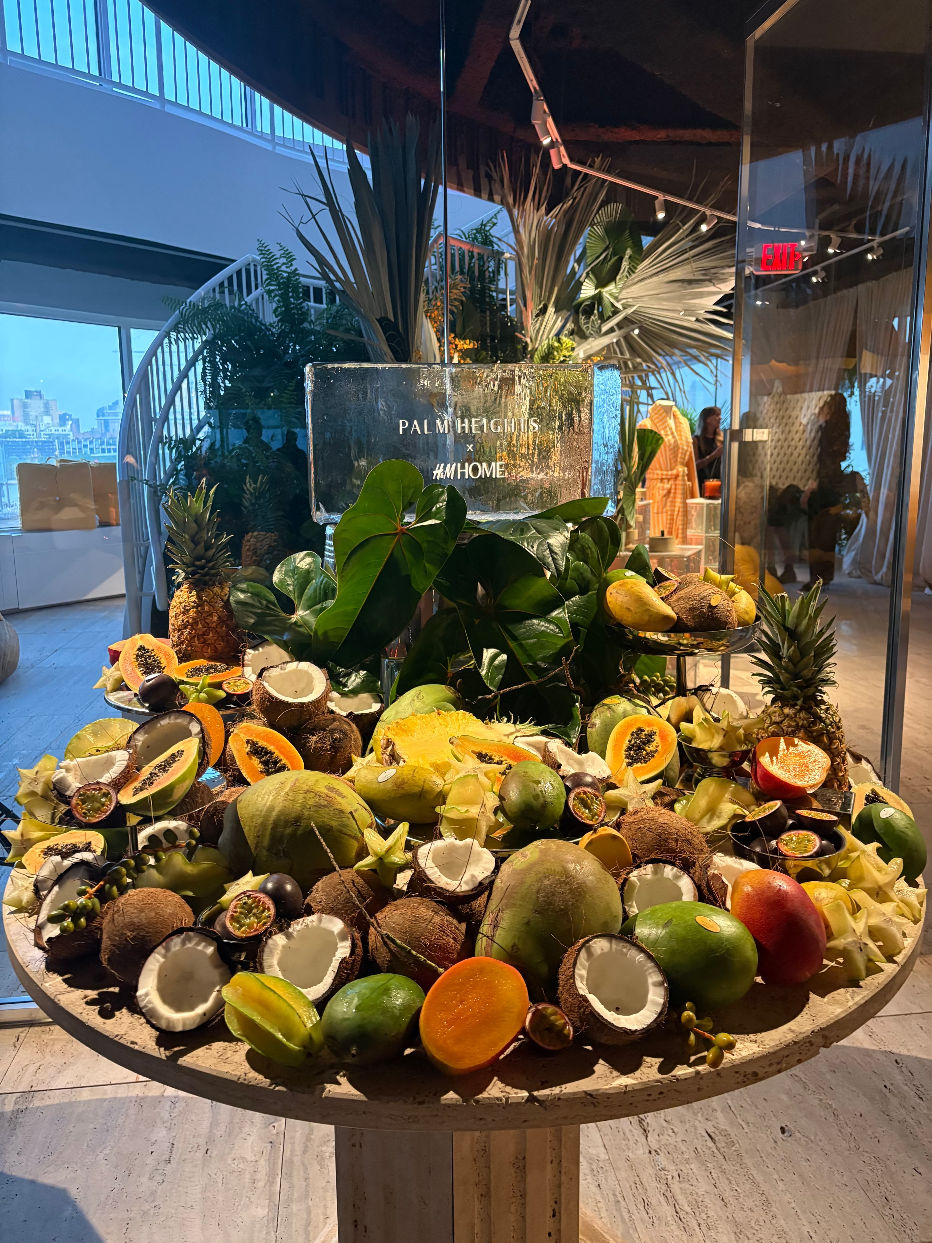 Tropical fruit installation with a Palm Heights and H&M Home ice block